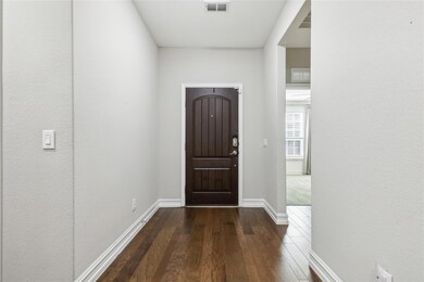 This elegant entry boasts beautiful wood flooring 