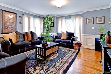 Living room featuring a wealth of natural light, o