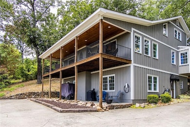 View of side of home featuring a balcony