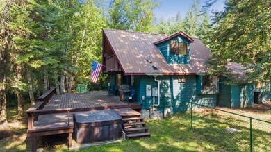 Side fenced yard with deck & hot tub