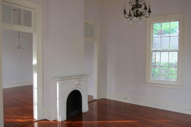 LIVING ROOM WITH STONE MANTLEPIECE