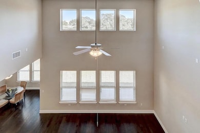 Detailed view of a ceiling fan and wood finished 