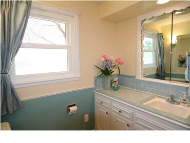 Bathroom. New lighting and new tile floor.