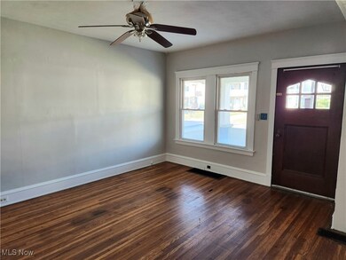 Living room featuring, solid hardwoods, ceiling fan