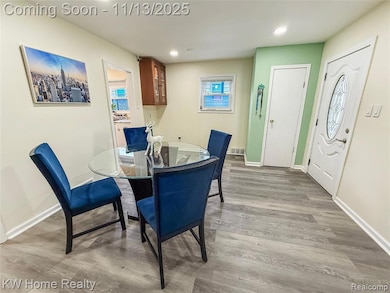 Dining room featuring light wood-style flooring and recessed lighting