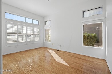 DEN HAS PLANTATION SHUTTERS TO LEFT