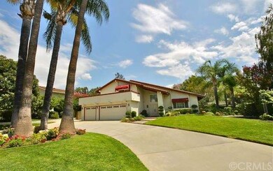 Circular driveway & lush landscaping