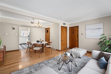 Living room/dining room virtually staged.