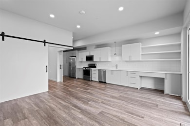 Kitchen featuring appliances with stainless steel