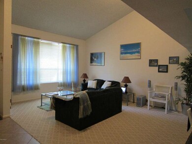 LIVING ROOM WITH VAULTED CEILING