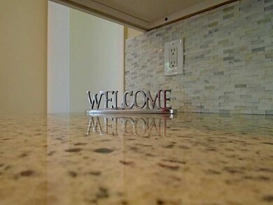Kitchen. WHITE GRANITE COUNTERS