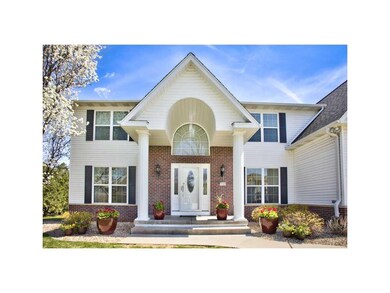Front Exterior. BEAUTIFUL BRICK ENTRANCE WITH COLU