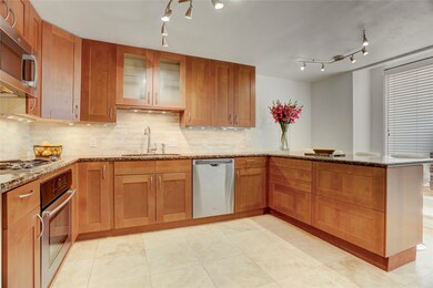 Discover a kitchen with sleek, modern cabinets fea