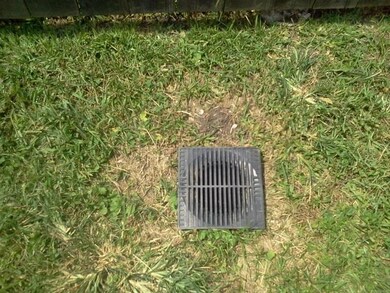 DRAINAGE LIKE THIS ONE THE ENTIRE LENGHT OF THE NORTHSIDE OF PROPERTY - KEEPS YARD REAL DRY