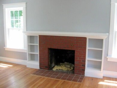 Living room with wood burning fireplace