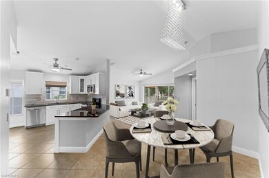 Tiled dining area with sink, ceiling fan with nota