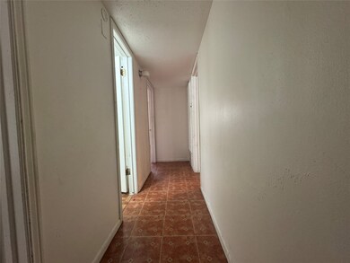 Hallway leading to second bath and master bedroom