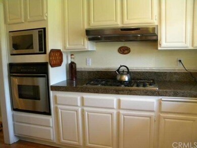 Kitchen view of 5 burner range top & built-in oven