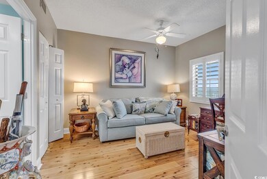 Living room featuring a textured ceiling, ceiling 
