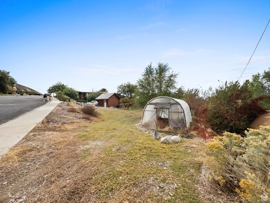 View of yard featuring an outbuilding and an exterior structure