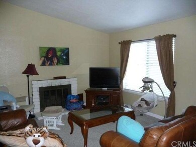 Living room with fireplace.  Vaulted ceilings in l