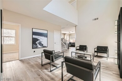 Living area featuring stairs, light wood-style flo