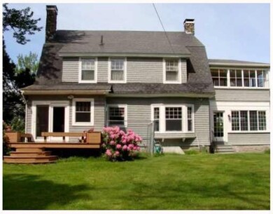 Back of house with bay window in...