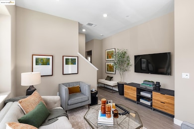 Living room with wood finished floors and recessed lighting