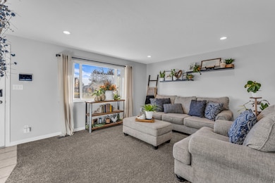Living area featuring recessed lighting and carpet floors