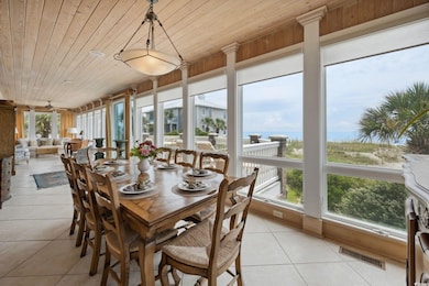 Sunroom featuring wooden ceiling