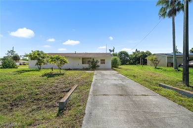 Single story home featuring driveway and a front l