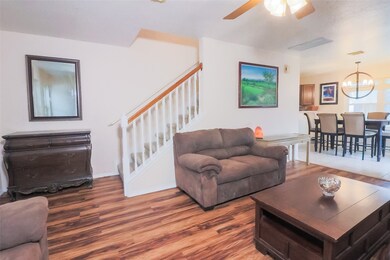 Living room opens to dining area