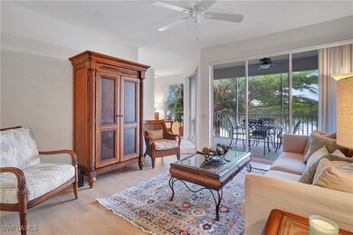 Living room featuring ceiling fan and light hardwo
