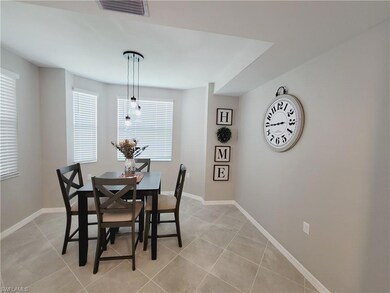 Dining area featuring light tile patterned floors
