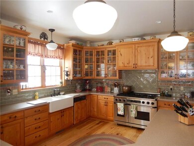 This chefs kitchen has Red Alder cabinetry, commer