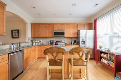 Spacious kitchen with stainless appliances, island