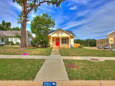Bungalow-style house featuring a front lawn