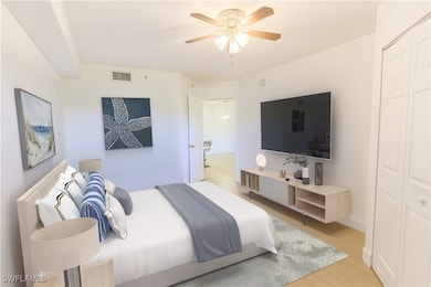 Bedroom with light wood-style floors, visible vent