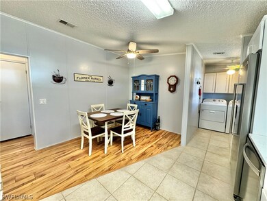 Dining space featuring crown molding, light wood-t