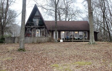 A-Frame style house with large sunroom added. Plenty of windows to view wildlife and the amazing scenery surrounding the property. Has a loft style bedroom upstairs with closet and separate dressing room. Walk-out deck on front and back