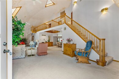 Front door entry to living room.  Coat closet as y