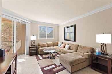 Living area featuring crown molding, a wealth of n