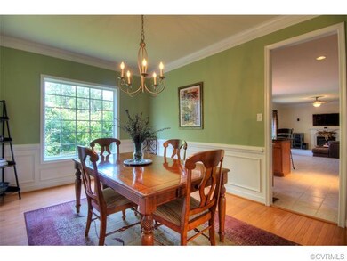 Gorgeous formal dining room with hardwoods, shadow