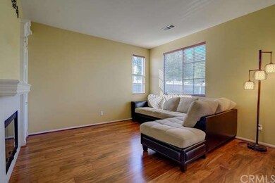 LIVING ROOM WITH COZY FIREPLACE & MEDIA NICHE MAKE