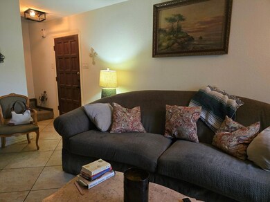 Living room featuring light tile patterned floors