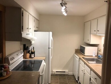 Fully stocked kitchen with dishwasher.