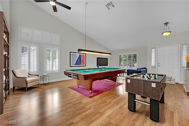 Rec room with pool table, ceiling fan, light wood-