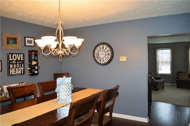Dining room opens to living room and kitchen to cr