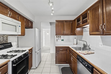 Dining room to foyer view of kitchen