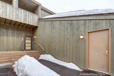 WALKWAY TO ENTRANCE PAST GARAGE MAN DOOR